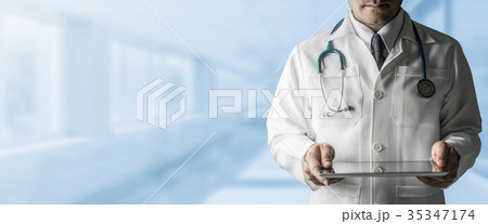 Male Doctor Holding Tablet Computer 35347174