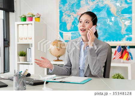 lady business manager using mobile cell phone 35348128