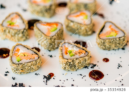 Close up delicious triangle sushi rolls on plate 35354926