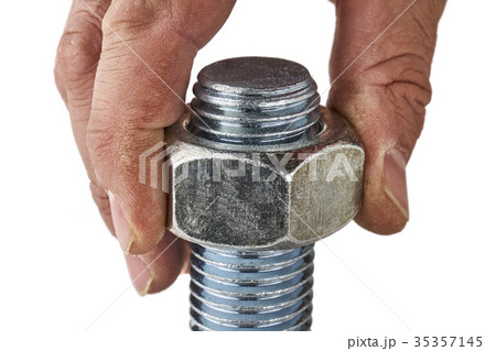 Male hand screweing nut on the bolt close up 35357145