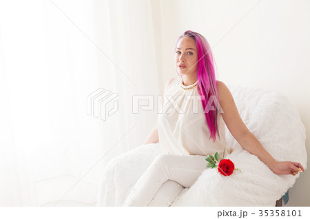 beautiful girl with pink hair reads the book beautiful girl with pink hair reads the book 35358101