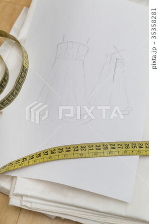 Sketch drawn on white paper with measuring tape Sketch drawn on white paper with measuring tape 35358281