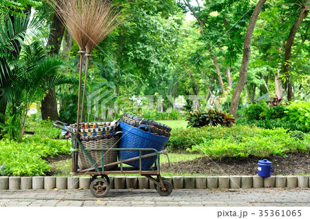 Used trolley contain plastic basket and long broom 35361065