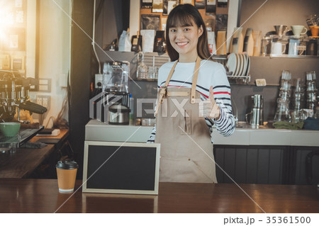 Asian barista hand showing thumb up. 35361500