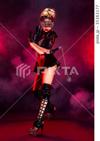 Model in black leather and chains Model in black leather and chains 35363177