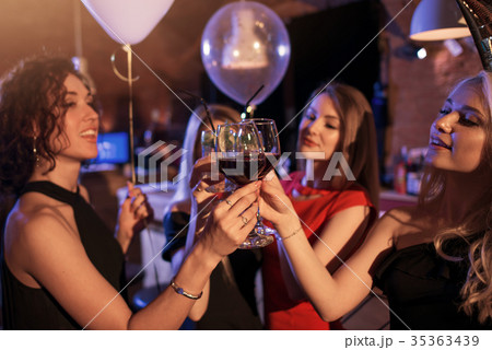Group of cheerful girls having a party standing 35363439