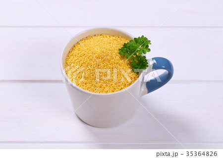 mug of raw millet grains mug of raw millet grains 35364826