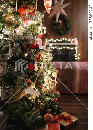 Christmas tree, bed and fireplace. Christmas tree, bed and fireplace. 35366289