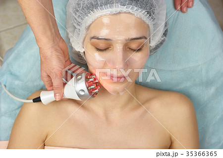 Young woman wearing collagen mask. Young woman wearing collagen mask. 35366365