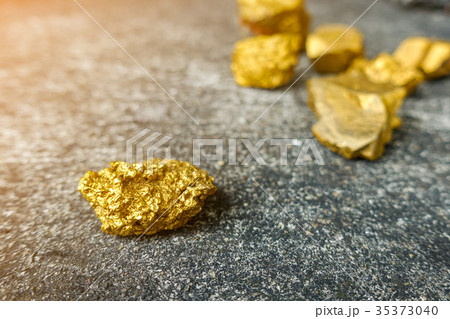 Gold ore mined from mines placed on rock. Gold ore mined from mines placed on rock. 35373040