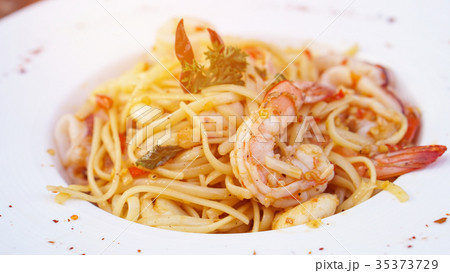 Spaghetti with spicy olive oil and seafood prawn Spaghetti with spicy olive oil and seafood prawn 35373729