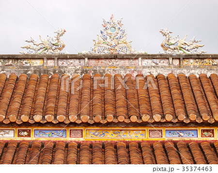 retro roof tiles and decorative ornaments closeup  35374463
