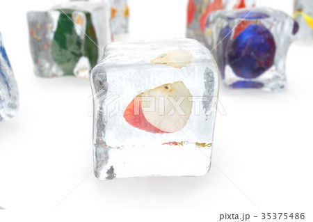 Apple in ice cube isolated on white with depth of Apple in ice cube isolated on white with depth of 35375486