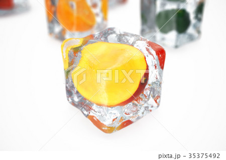 Mango in ice cube isolated on white with depth of Mango in ice cube isolated on white with depth of 35375492