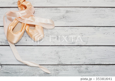 Ballet shoes on wooden floor 35381641