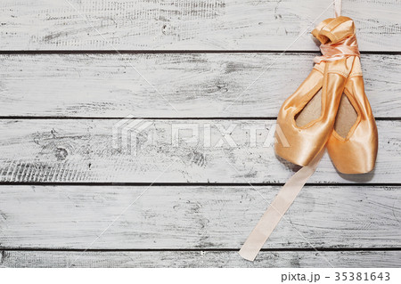 Russian ballet shoes on wooden stage 35381643