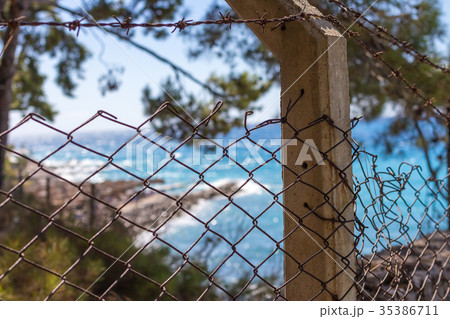 Beautiful and Blur Blue Sea View back of fence. 35386711