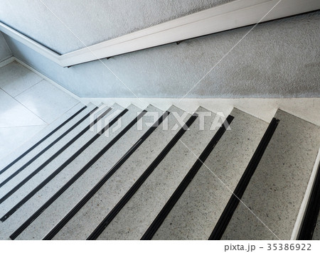 White marble staircase with the metal handrail. White marble staircase with the metal handrail. 35386922