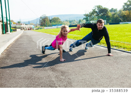 Man and woman doing push-up 35388539