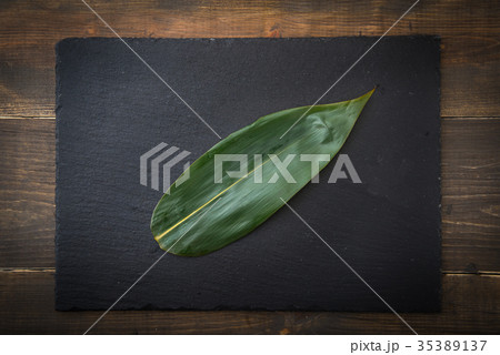 japanese sasa leaf on black plate japanese sasa leaf on black plate 35389137