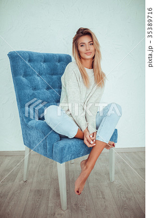 full length portrait of pretty woman sits on a 35389716