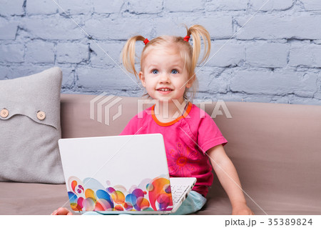 child girl three years old uses for training laptop computer 35389824