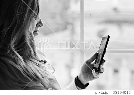 Young adult girl with phone Young adult girl with phone 35394013