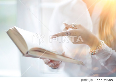 Young adult girl with book learning, reading, business Young adult girl with book learning, reading, business 35394309