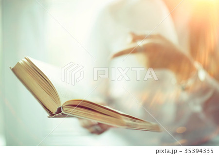 Young adult girl with book learning, reading, business Young adult girl with book learning, reading, business 35394335
