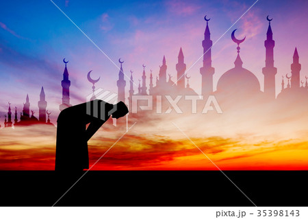 Islamic man praying Muslim Prayer in Twilight time 35398143