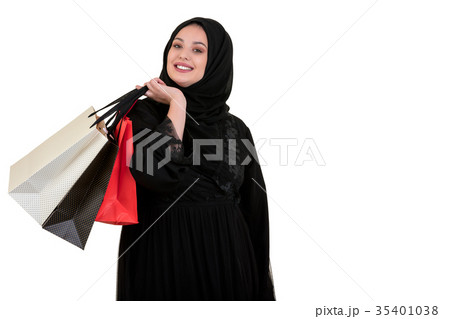 Arabian woman carrying shopping bags isolated on Arabian woman carrying shopping bags isolated on 35401038