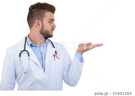 Portrait of a smiling male doctor pointing finger Portrait of a smiling male doctor pointing finger 35401204