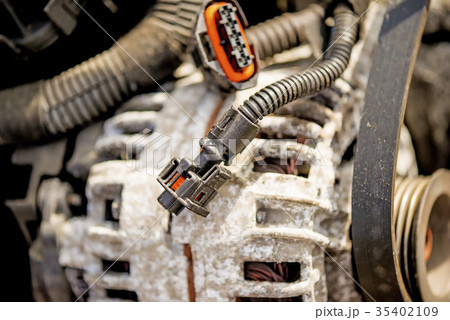 car alternator on a scrap yard car alternator on a scrap yard 35402109