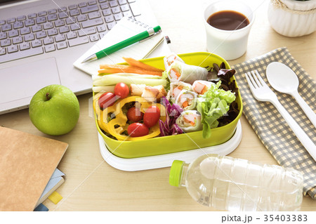 green Lunch box on the work place green Lunch box on the work place 35403383