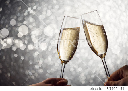 Photo of two wine glasses with wine on gray 35405151