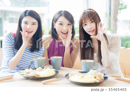 happy woman friends in restaurant happy woman friends in restaurant 35405405