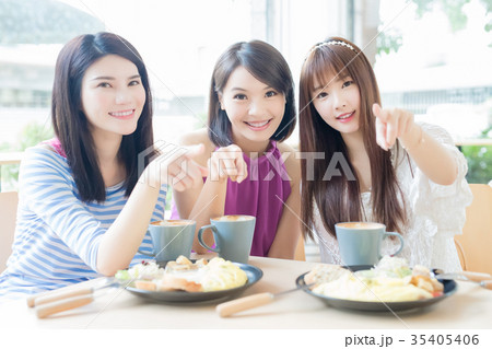 happy woman friends in restaurant happy woman friends in restaurant 35405406