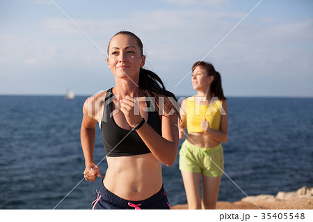 girls play sports jog on the beach girls play sports jog on the beach 35405548