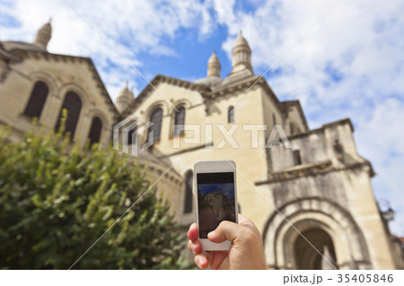 Tourist taking photo of Perigueux, France Tourist taking photo of Perigueux, France 35405846