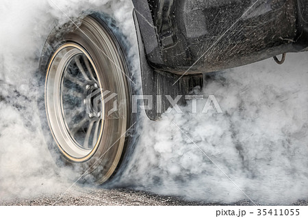 Drag racing car burn tires for the race Drag racing car burn tires for the race 35411055