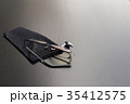 Old black glasses with broken legs. 35412575