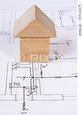 House of wooden blocks on construction drawing House of wooden blocks on construction drawing 35413275
