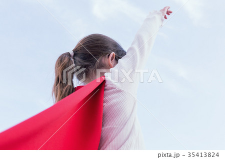 Superhero kid against blue sky background Superhero kid against blue sky background 35413824
