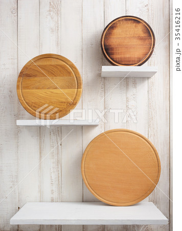 pizza cutting board at shelf on  wooden background 35416216