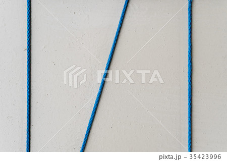 Blue rope on white wall for backdrop Blue rope on white wall for backdrop 35423996