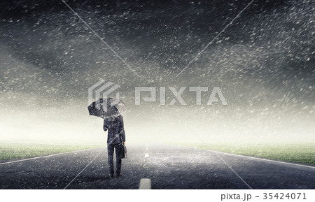 Man with black umbrella Man with black umbrella 35424071