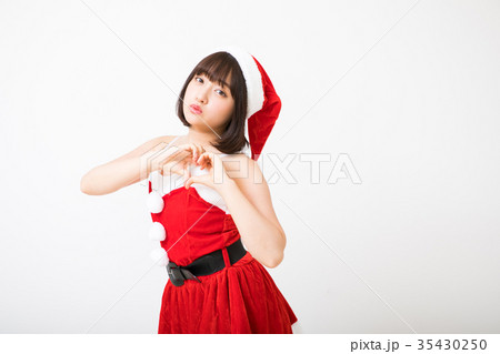 女性 クリスマス サンタの写真素材