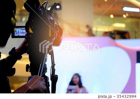 Photographer video recording activity in the event 35432994