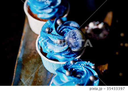 Incredible cosmic blue cupcakes with decoration in Incredible cosmic blue cupcakes with decoration in 35433397