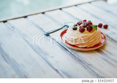 Dessert Anna Pavlova with raspberries and Dessert Anna Pavlova with raspberries and 35433457